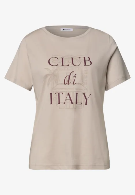 Beiges T-Shirt mit Aufdruck 'CLUB di ITALY' und dezenten Palmen-Illustrationen.