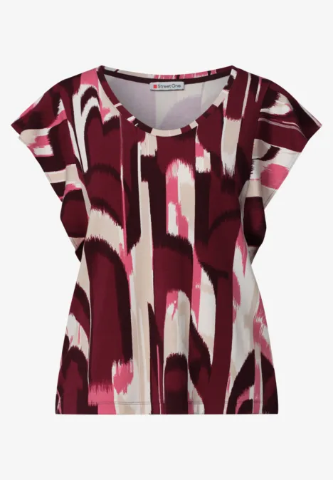Dames-T-shirt met V-hals, korte mouwen in abstract rood-roze-wit dessin.