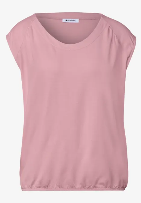 Locker geschnittenes, rosafarbenes Kurzarmshirt mit weitem Rundhalsausschnitt und elastischem Bund.