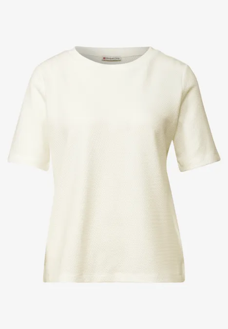 T-shirt à col rond et texturé off white Schlichtes, cremefarbenes T-Shirt mit kurzen Ärmeln auf weißem Hintergrund.