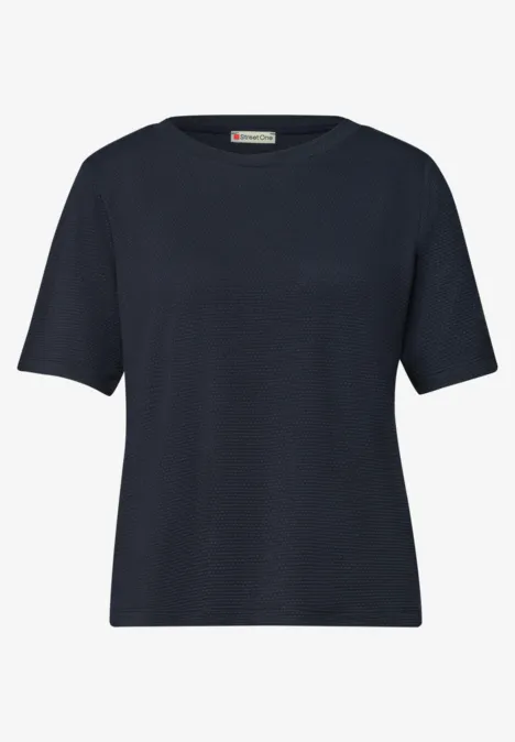 T-shirt bleu marine uni à manches courtes et col rond.