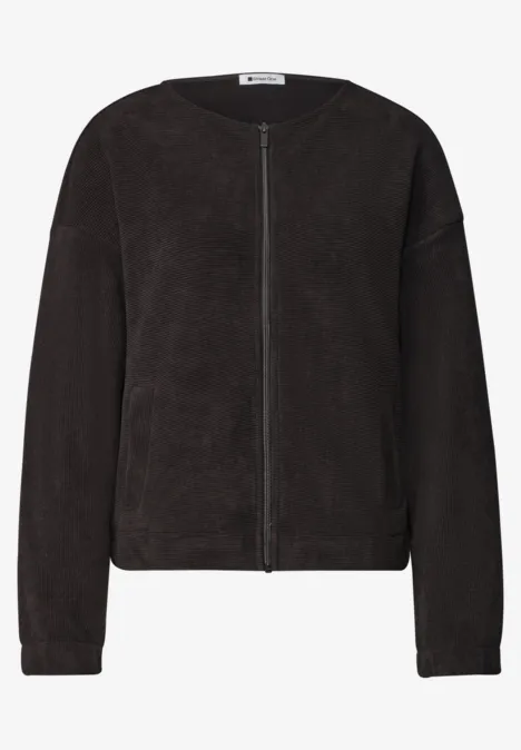 Veste polaire noire zippée, style épuré et coupe classique.