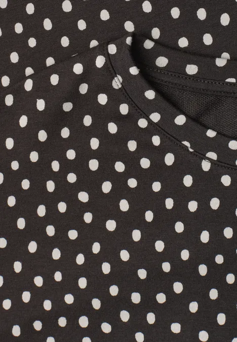 Batwing-shirt met ronde hals en print black coffee Zwart kledingstuk met witte stippen en ronde hals.