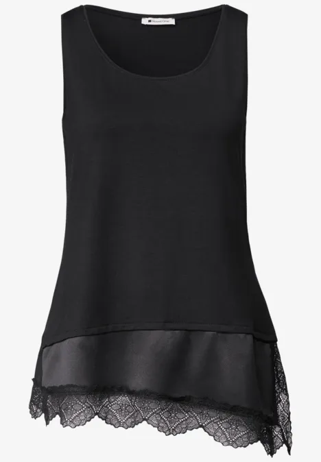 Top met ronde hals en decoratieve kant Black Mouwloze zwarte top met gelaagde kanten zoom en lichte chiffon onderlaag