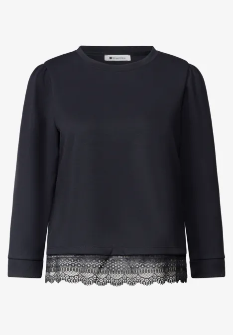 Schwarzes Langarmshirt mit Spitze am Saum