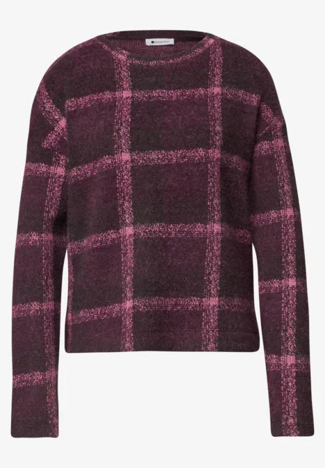 Lila Pullover mit rosa Karomuster, langärmlig und rundem Halsausschnitt.