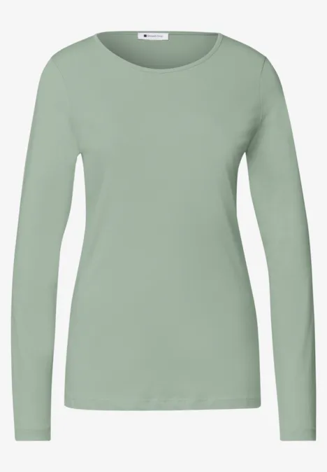 Jednokolorowa koszulka Basic z długim rękawem eucalyptus green Jednokolorowa bluzka damska w pudrowej zieleni, długie rękawy i okrągły dekolt.