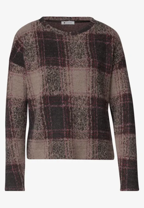 Pull ample à motif à carreaux marron et rouge, col rond et manches longues.
