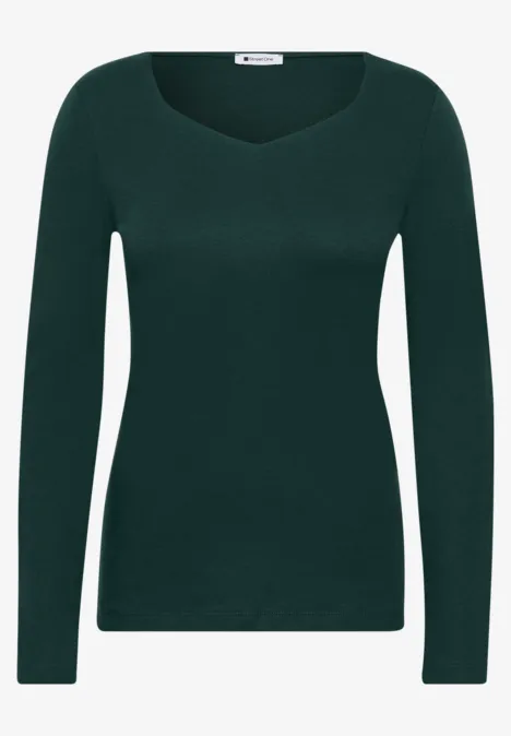 Haut femme ajusté à manches longues et col rond, de couleur vert foncé.