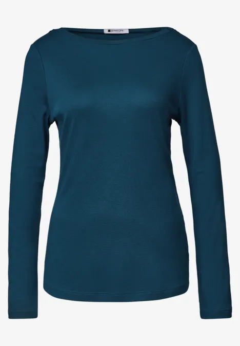 Langärmeliges, schlichtes, taubenblaues Shirt mit Rundhalsausschnitt.