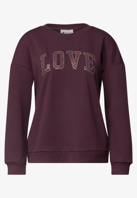 Sweat femme bordeaux avec inscription LOVE dorée sur le devant.