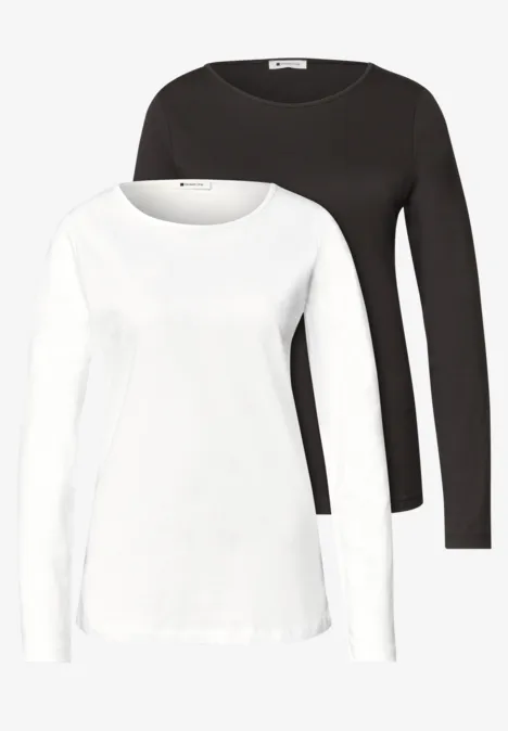 Zwei klassische, einfarbige Langarmshirts in Schwarz und Weiß mit rundem Ausschnitt.