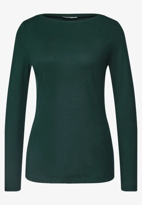 Ein dunkelgrünes, schlichtes Langarmshirt für Damen ohne Muster.