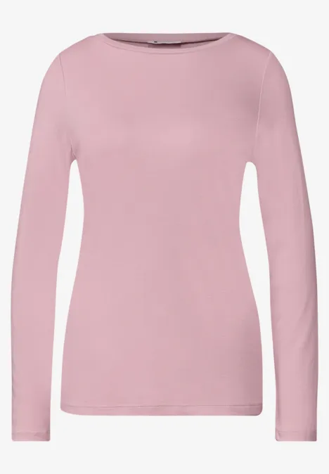 Simpel effen roze damesshirt met lange mouwen en ronde hals.