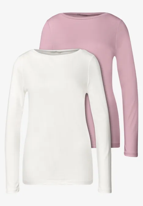 Twee effen lange-mouwshirts, één wit en één roze met ronde hals.