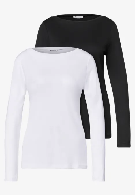 Zwei unifarbene Langarmshirts, eins weiß und eins schwarz, mit Rundhalsausschnitt.
