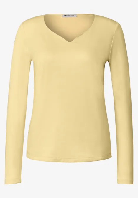 Helles zitronengelbes, langärmeliges Damenshirt mit V-Ausschnitt, schlicht und elegant.