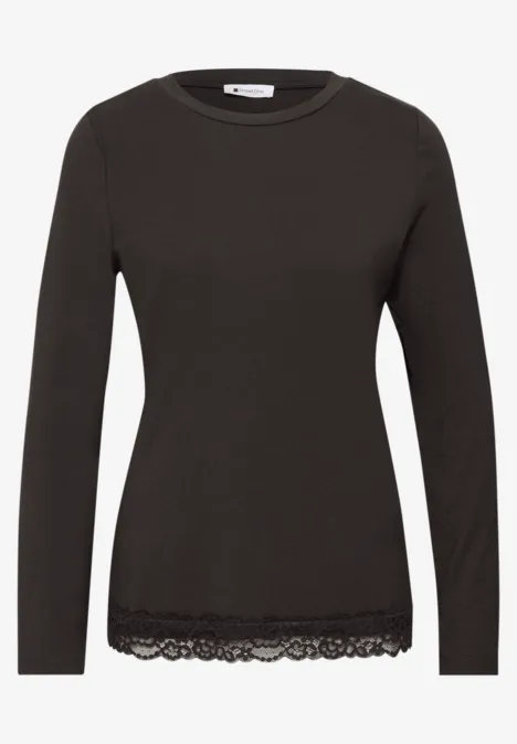Schwarzes Langarmshirt mit Rundhalsausschnitt und Spitzenbesatz am Saum