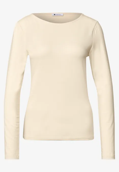 T-shirt femme manches longues crème avec encolure ronde.