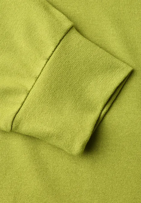 Shirt met gebreide look en vleermuismouwen apple lime Close-up van groene sweatermouw met boord.