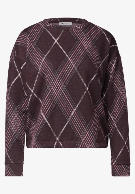 Pull bordeaux à manches longues avec motif écossais rose et blanc, coupe large et droite.
