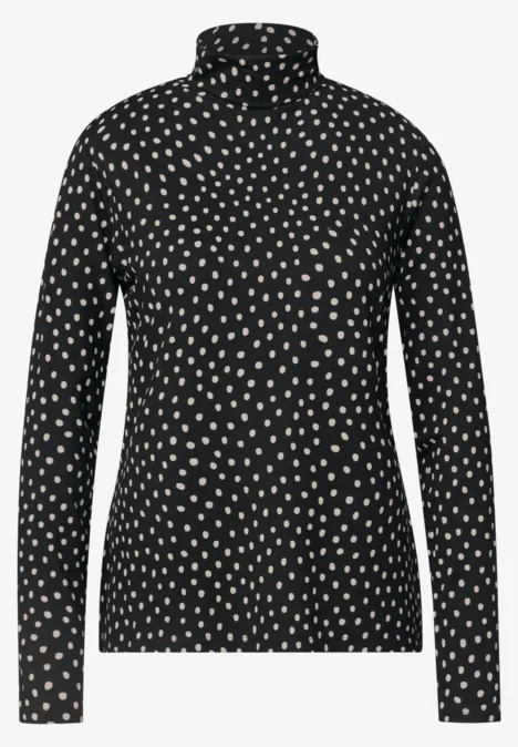 Eenvoudig shirt met col en patroon Black Een zwarte coltrui met wit polkadotpatroon.
