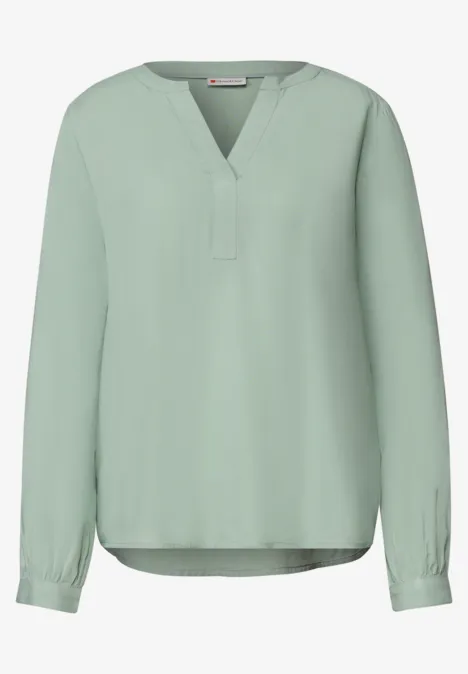 Lichte mintgroene blouse met lange mouwen en V-hals