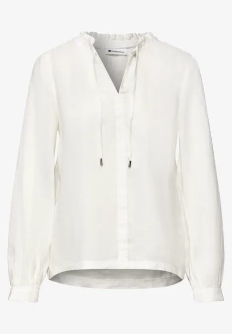Witte lange mouwen blouse met V-hals en bindkoordjes.