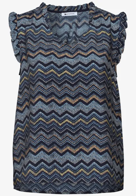 Leichte ärmellose Bluse mit buntem Zickzackmuster und verspieltem Rüschensaum.