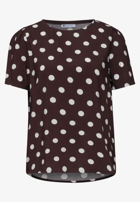 Braunes T-Shirt mit weißen Punkten, kurzarm.