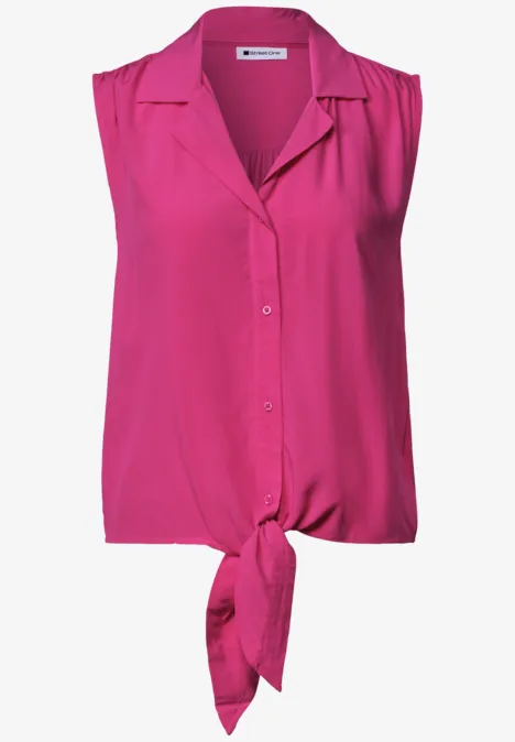 Ärmellose pinke Bluse mit Kragen, durchgehender Knopfleiste und Knoten am Saum.