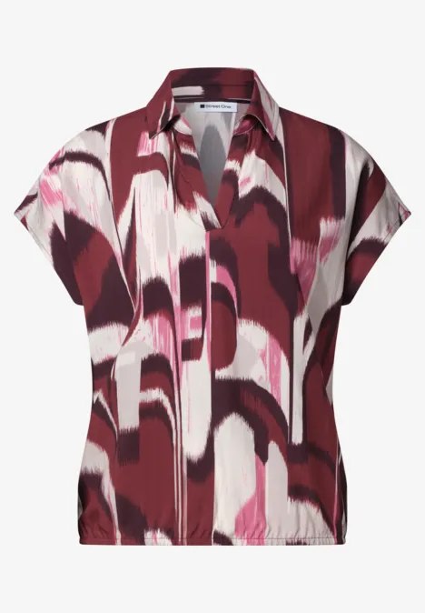 Kort mouwenshirt met abstract patroon in rood, roze en wit