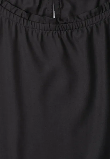 Blouse met gerimpelde ronde hals Black Schwarzer Rock aus leicht glänzendem Stoff mit elastischem Bund und verdecktem Reißverschluss.