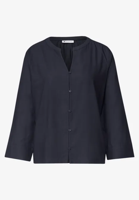 Chemisier bleu marine à manches longues, col en V et patte de boutonnage