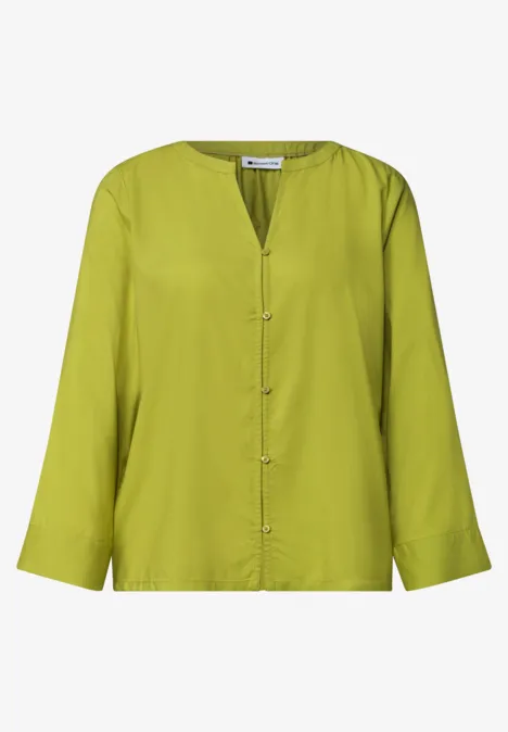 Blouse met 3/4-mouwen en split in de hals apple lime Lichte, lange mouwen blouse in felgroen met V-hals en knoopsluiting.