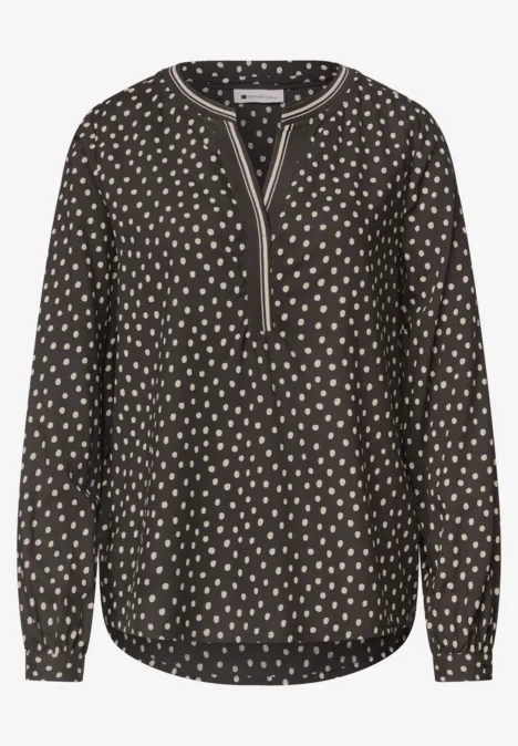 Langarm Tunika mit Split Neck und Print black coffee Schwarze Bluse mit cremefarbenen Tupfen, V-Ausschnitt, langen Ärmeln und abgerundetem Saum.