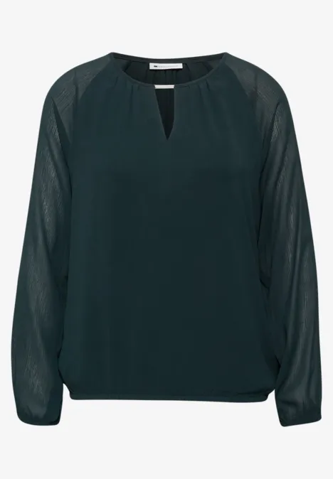 Dunkelgrüne Chiffon-Bluse mit langen, transparenten Ärmeln und kleinem Ausschnitt.