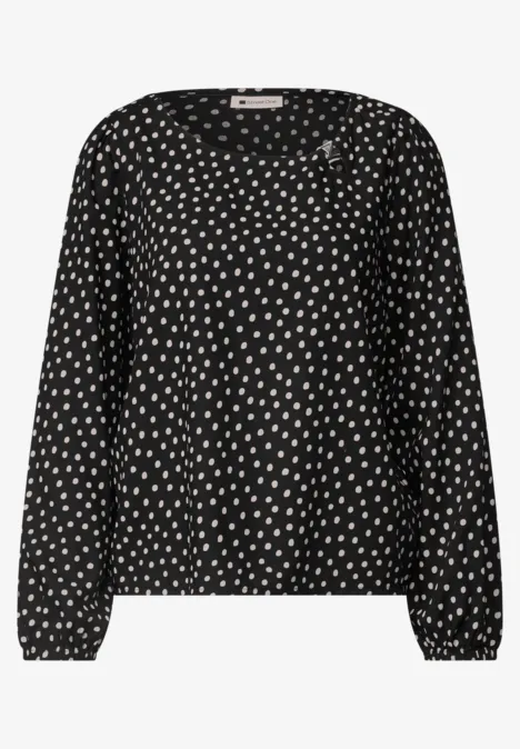Zwarte blouse met lange mouwen en witte stippen
