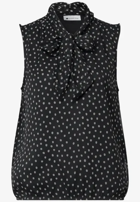 Bluzka z Chiffonu z kokardką Black Czarna bluzka bez rękawów w białe kropki z kokardą przy szyi.