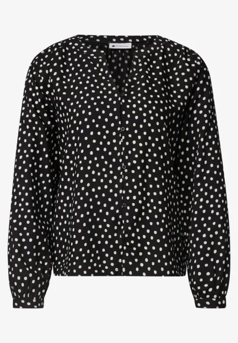 Schwarze Bluse mit weißem Herzmuster, V-Ausschnitt und langen Ärmeln