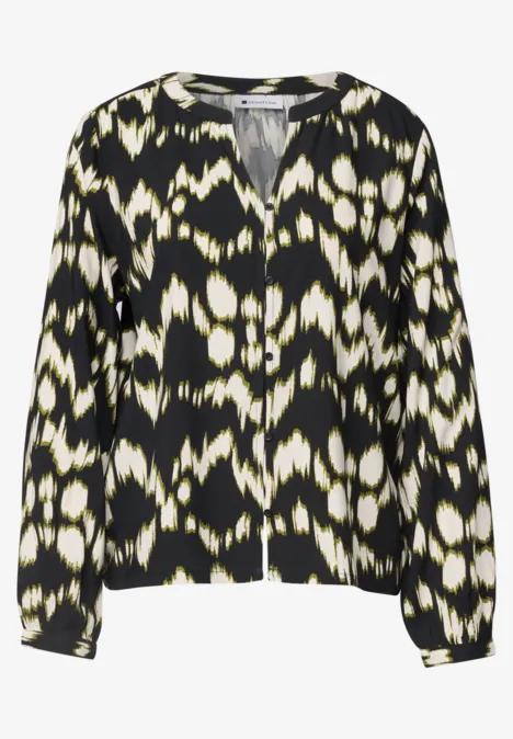 Chique blouse met lange mouwen, zwart-wit abstract patroon en V-hals.