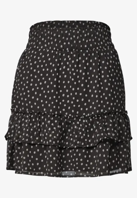 Kniehoge chiffonrok met print black coffee Schwarzer Rock mit weißen Polka Dots und Stufenrüschen