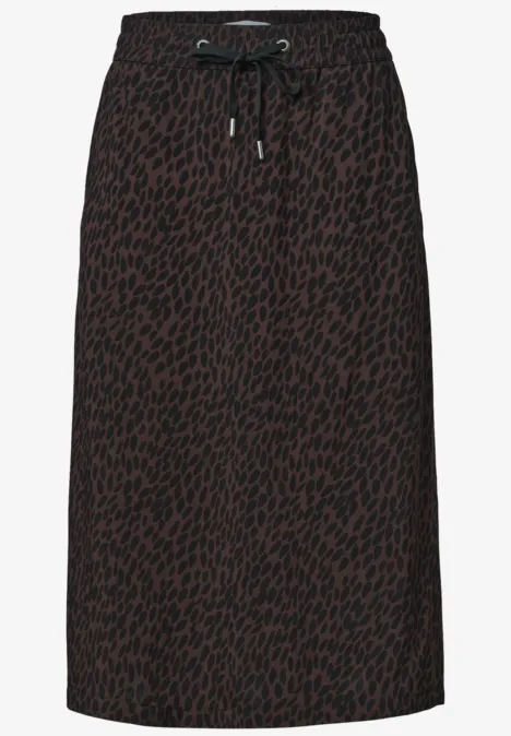 Jupe mi-longue à taille élastiquée et fentes molten earth Jupe midi marron à imprimé léopard noir, taille élastique avec cordon.