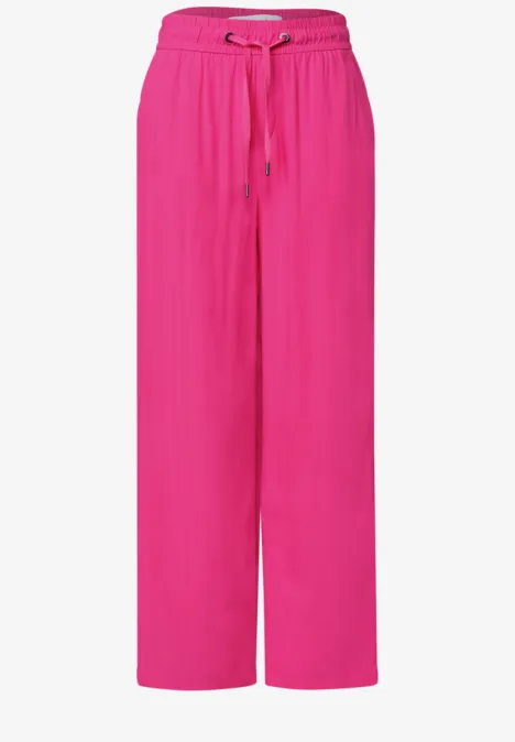 Weit geschnittene pinke Hose mit Tunnelzugbund und lässigem, fließendem Schnitt.