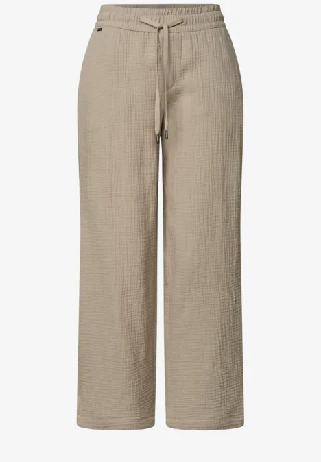 Hellbeige, locker geschnittene Hose aus strukturierter Baumwolle mit elastischem Bund und Kordelzug