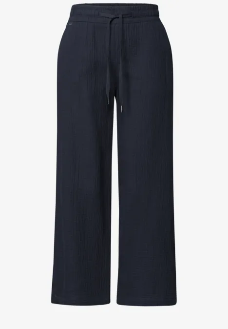 Pantalon bleu marine ample à cordon de serrage et poches latérales.