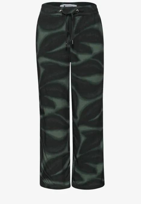 Lässige weite Hose mit grün-schwarzem abstraktem Wirbelmuster und Tunnelzugbund.