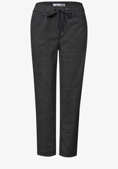 Pantalon femme noir ajusté avec motif discret, taille élastique et cordon de serrage.
