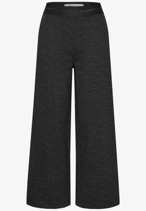 Pantalon taille haute à jambes larges avec un motif raffiné Black Pantalon noir ample à taille haute et jambes larges.