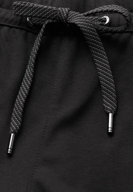 Pantalon taille haute Barrel Leg, coupe décontractée Black Schwarzer Textilstoff mit mittig geknotetem Kordelzug und silberfarbenen Metallenden.